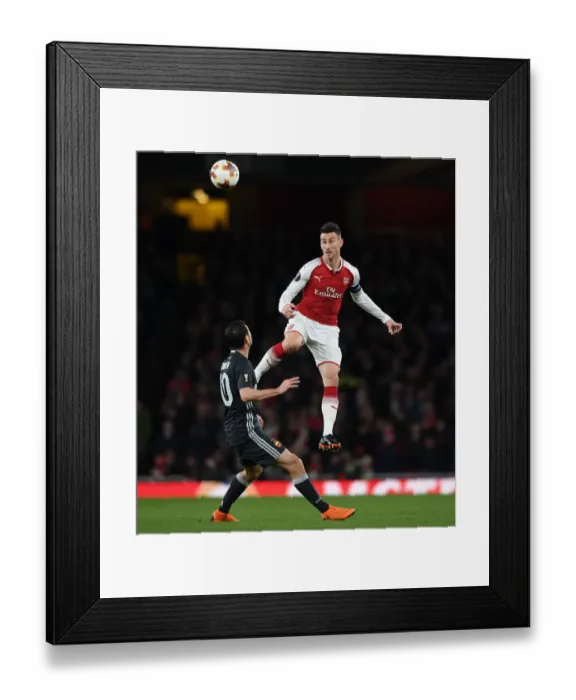 Framed Print : Clash of Heads: Koscielny vs. Dzagoev in Arsenal's Europa League Battle Framed Print : Clash of Heads: Koscielny vs. Dzagoev in Arsenal's Europa League Battle