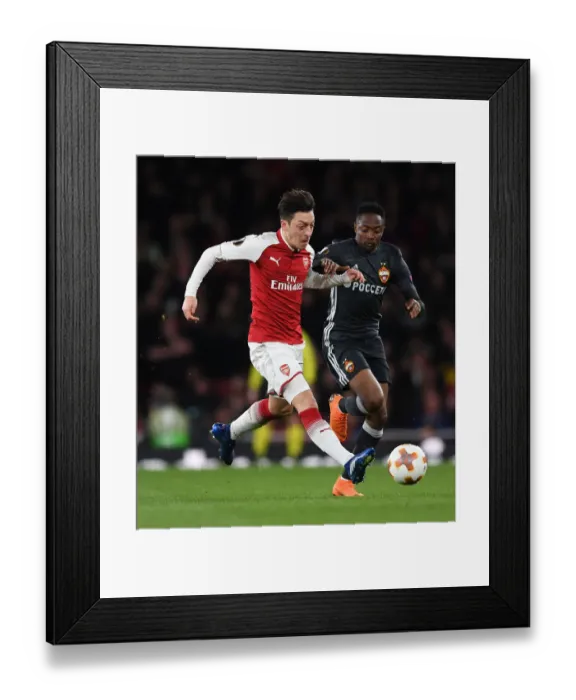Framed Print : Arsenal's Ozil and Musa Clash in Europa League Quarterfinal