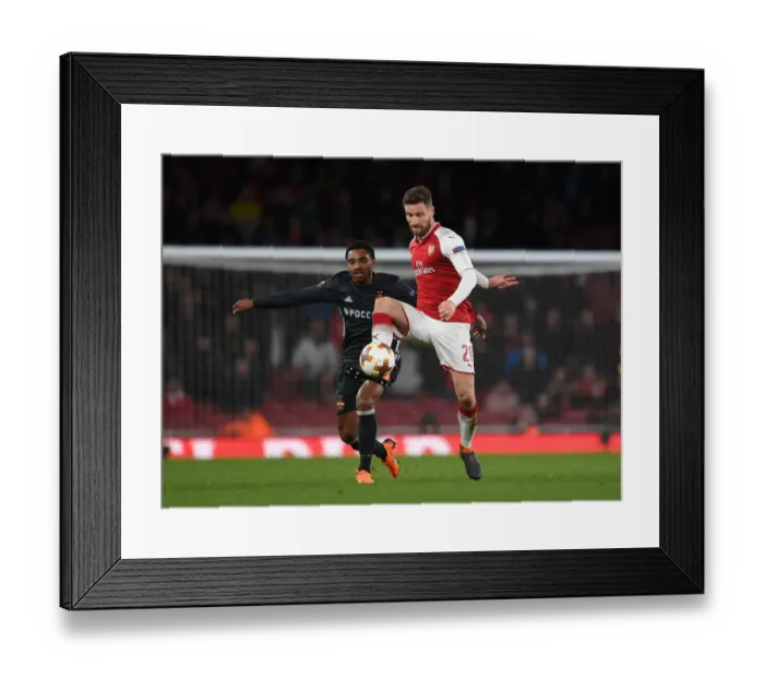 Framed Print : Arsenal's Mustafi Clashes with Musa in Europa League Quarterfinal
