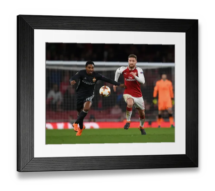 Framed Print : Arsenal vs CSKA Moskva: Mustafi Clashes with Musa in Europa League Quarterfinal