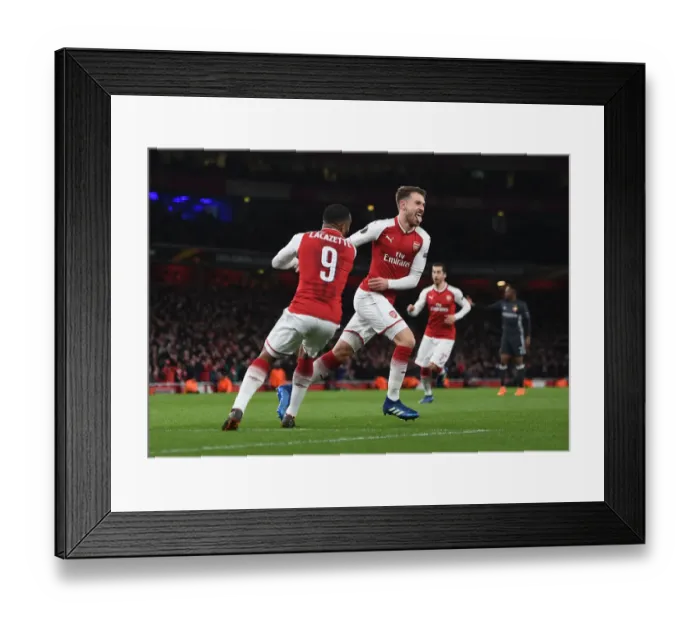 Framed Print : Arsenal's Double Act: Ramsey and Lacazette Celebrate Goals in Europa League Quarterfinal vs. CSKA Moscow