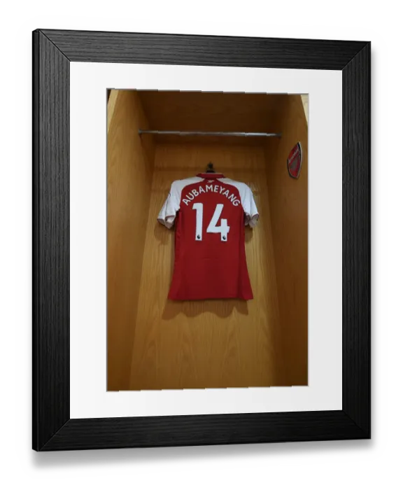 Framed Print : Arsenal's Aubameyang-Emblazoned Jersey in the Emirates Changing Room (Arsenal v Southampton, 2017-18)