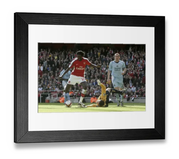 Framed Print : Emmanuel Adebayor rounds Shay Given Framed Print : Emmanuel Adebayor rounds Shay Given