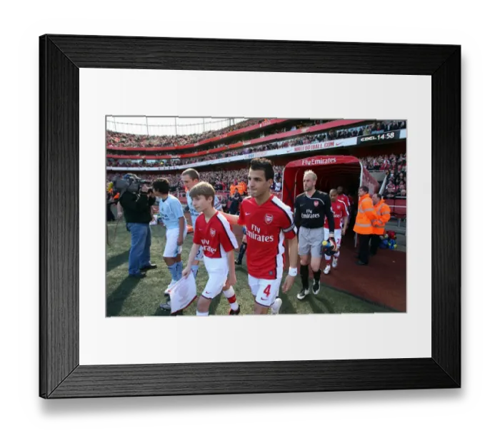 Framed Print : Cesc Fabregas and Manuel Almunia lead out Arsenal