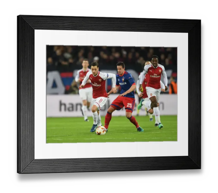 Framed Print : Ozil vs. Bistrovic: A Battle in the Europa League Quarterfinals between CSKA Moscow and Arsenal FC Framed Print : Ozil vs. Bistrovic: A Battle in the Europa League Quarterfinals between CSKA Moscow and Arsenal FC