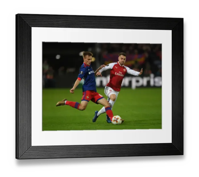 Framed Print : Arsenal's Aaron Ramsey Closes Down CSKA Moscow's Konstantin Kuchaev in Europa League Quarterfinal Framed Print : Arsenal's Aaron Ramsey Closes Down CSKA Moscow's Konstantin Kuchaev in Europa League Quarterfinal