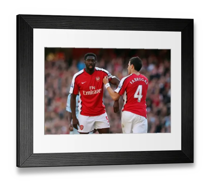 Framed Print : Cesc Fabregas hands over the captains arm band to Kolo Toure