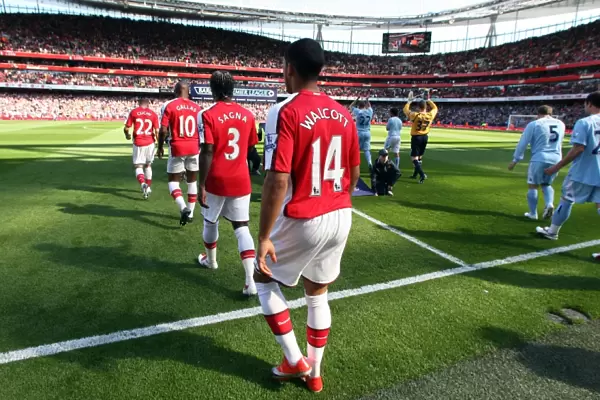 Theo Walcott (Arsenal) walks out onto the pitch