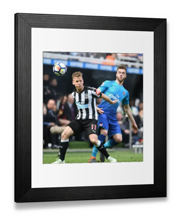 Framed Print : Clash at St. James Park: Chambers vs. Ritchie in Newcastle-Arsenal Premier League Battle Framed Print : Clash at St. James Park: Chambers vs. Ritchie in Newcastle-Arsenal Premier League Battle