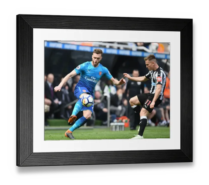 Framed Print : Clash at St. James Park: Chambers vs. Ritchie - Premier League Battle Framed Print : Clash at St. James Park: Chambers vs. Ritchie - Premier League Battle