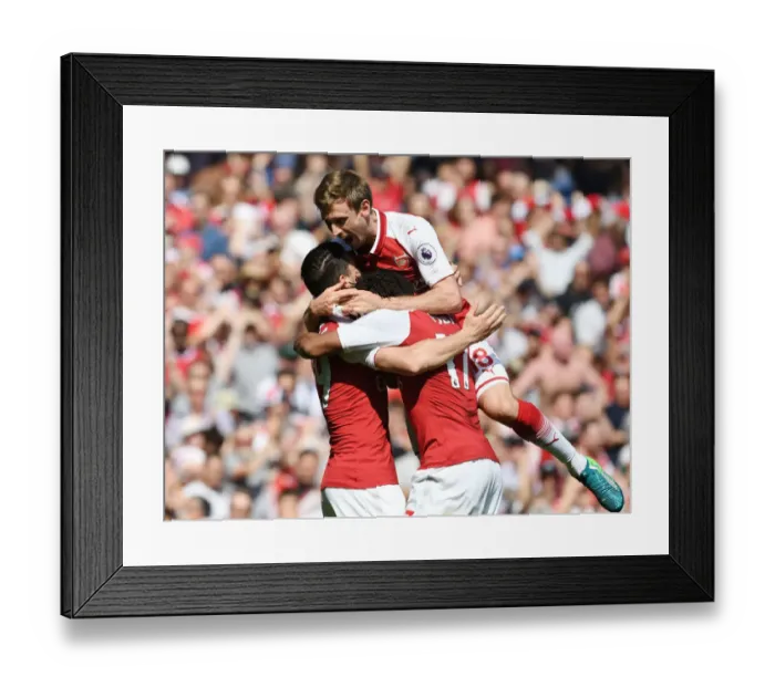 Framed Print : Arsenal's Unforgettable Triumph: Monreal, Xhaka, Iwobi's Euphoric Celebration vs. West Ham United (2017-18)