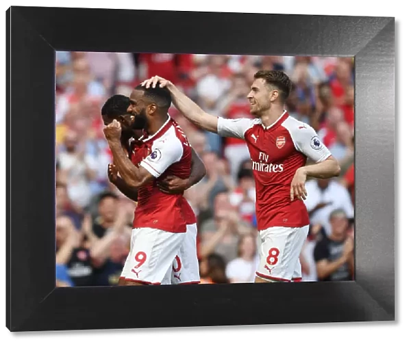 Arsenal's Lacazette, Maitland-Niles, and Ramsey Celebrate Goals Against West Ham