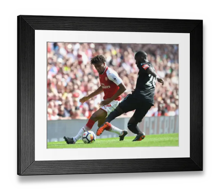 Framed Print : Intense Face-Off: Iwobi vs. Masuaku in Arsenal vs. West Ham Clash