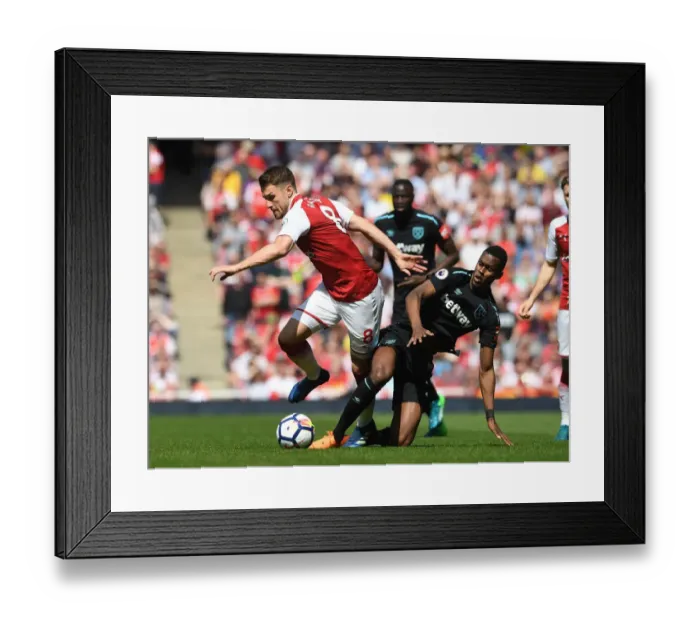 Framed Print : Intense Rivalry: Ramsey vs. Fernandes Clash in Arsenal vs. West Ham Football Match
