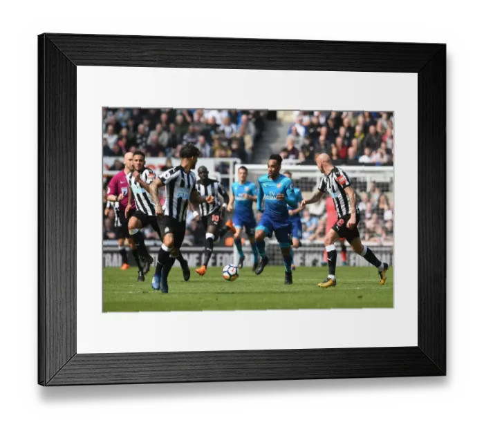 Framed Print : Pierre-Emerick Aubameyang Charges Forward Against Newcastle United in Premier League Clash