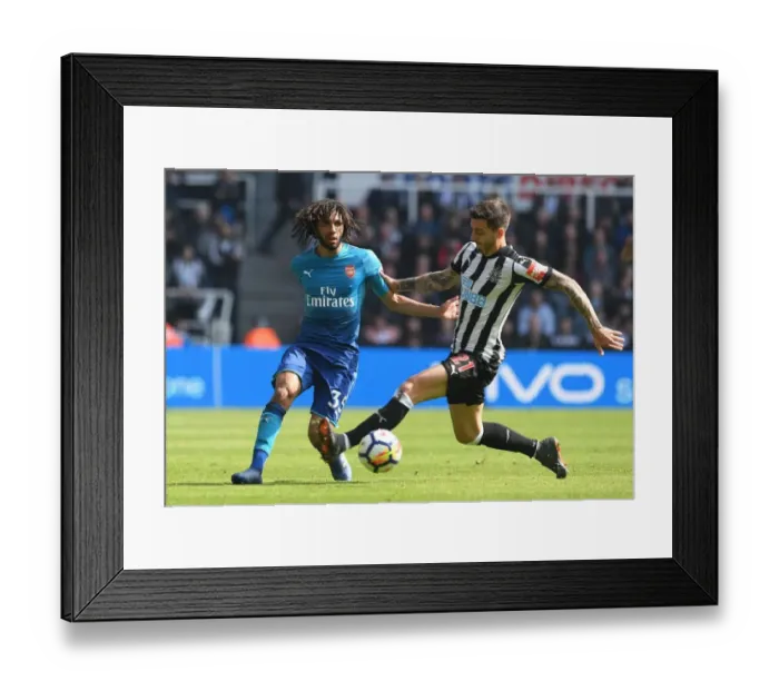 Framed Print : Elneny vs Joselu: Intense Battle in Newcastle United vs Arsenal Premier League Clash Framed Print : Elneny vs Joselu: Intense Battle in Newcastle United vs Arsenal Premier League Clash