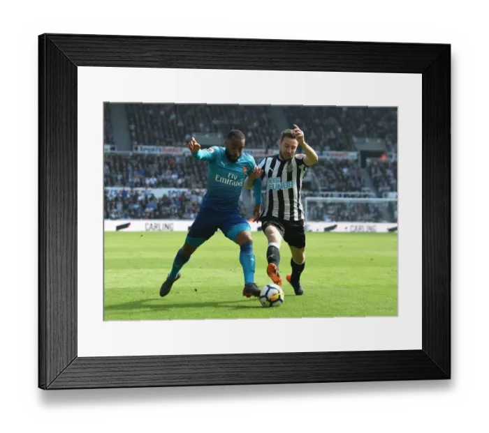 Framed Print : Arsenal's Alexandre Lacazette Clashes with Newcastle's Paul Dummett in Premier League Showdown Framed Print : Arsenal's Alexandre Lacazette Clashes with Newcastle's Paul Dummett in Premier League Showdown