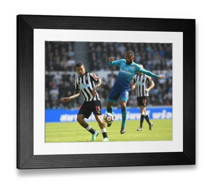 Framed Print : Clash at St. James Park: Lacazette vs. Kenedy - Arsenal vs. Newcastle United, Premier League