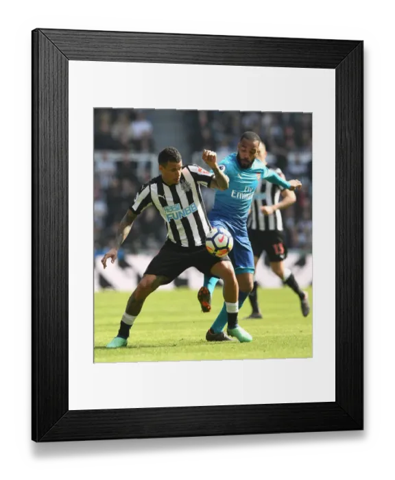 Framed Print : Clash at St. James Park: A Battle Between Lacazette and Kenedy - Arsenal vs. Newcastle United, Premier League