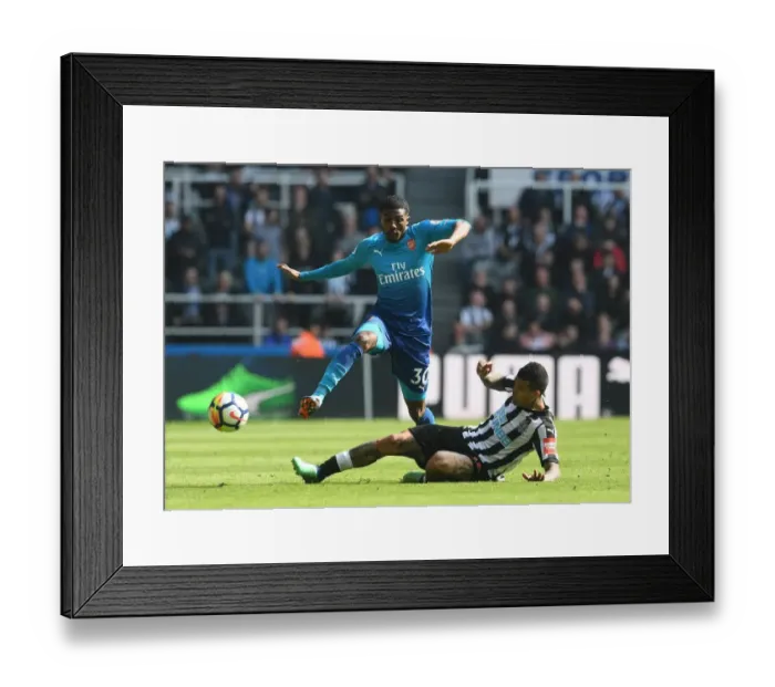 Framed Print : Clash at St. James Park: Ainsley Maitland-Niles vs Kenedy Framed Print : Clash at St. James Park: Ainsley Maitland-Niles vs Kenedy