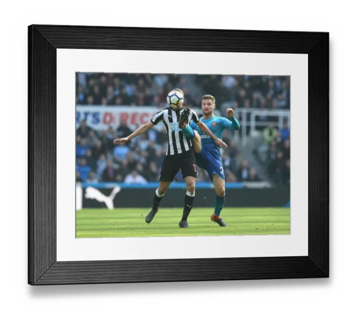 Framed Print : Mustafi vs Slimani: Intense Battle in Newcastle United vs Arsenal Premier League Clash Framed Print : Mustafi vs Slimani: Intense Battle in Newcastle United vs Arsenal Premier League Clash