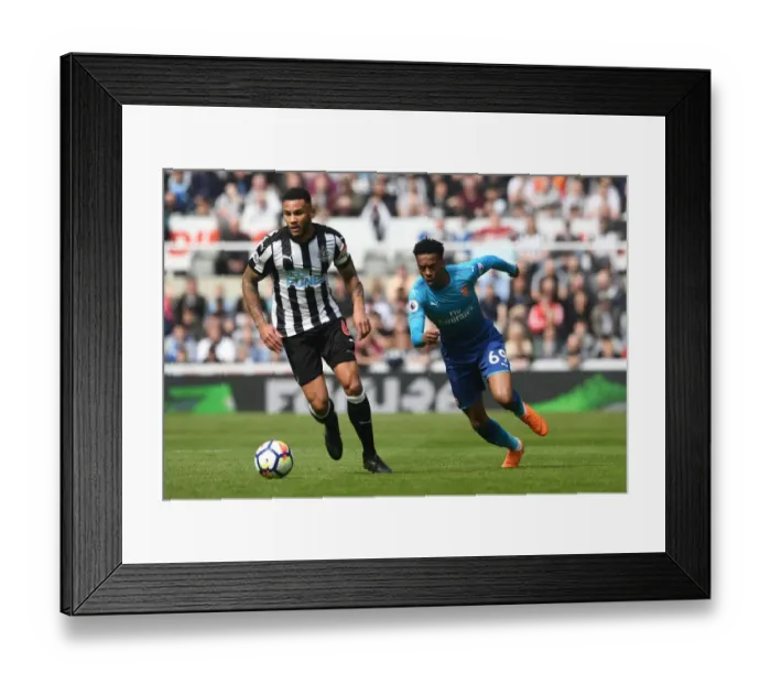 Framed Print : Joe Willock vs Jamaal Lascelles: Intense Battle in Newcastle United vs Arsenal Premier League Clash Framed Print : Joe Willock vs Jamaal Lascelles: Intense Battle in Newcastle United vs Arsenal Premier League Clash