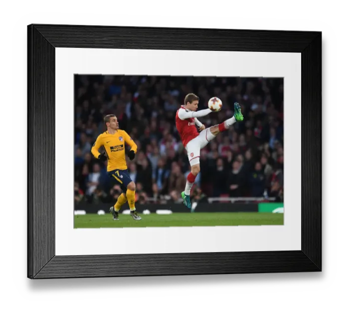 Framed Print : Monreal under Pressure: Arsenal's Nacho Fends Off Griezmann in Europa League Semi-Final Clash