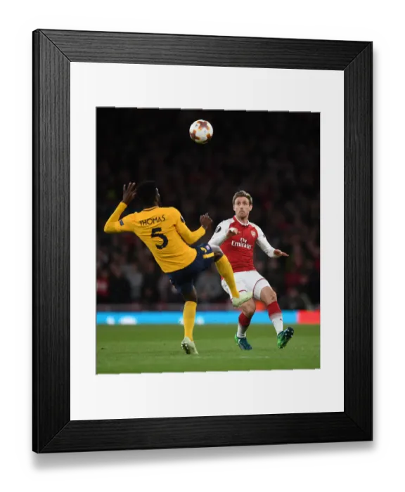 Framed Print : Arsenal vs Atletico Madrid: Monreal vs Partey - UEFA Europa League Semi-Final Showdown Framed Print : Arsenal vs Atletico Madrid: Monreal vs Partey - UEFA Europa League Semi-Final Showdown