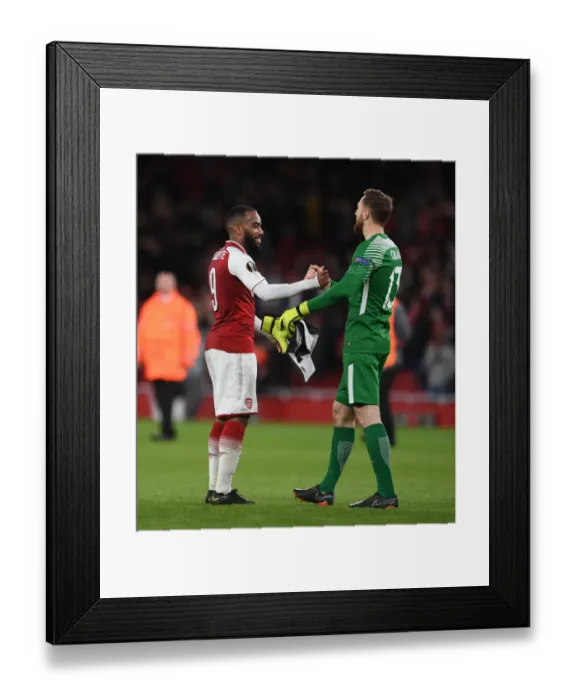 Framed Print : Arsenal's Lacazette and Atletico's Oblak Exchange Handshakes in Europa League Semi-Final
