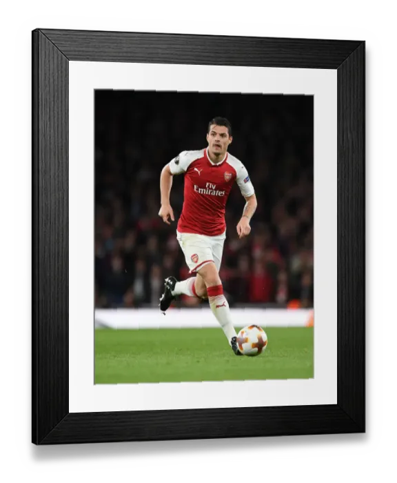 Framed Print : Granit Xhaka in Action for Arsenal against Atletico Madrid Framed Print : Granit Xhaka in Action for Arsenal against Atletico Madrid
