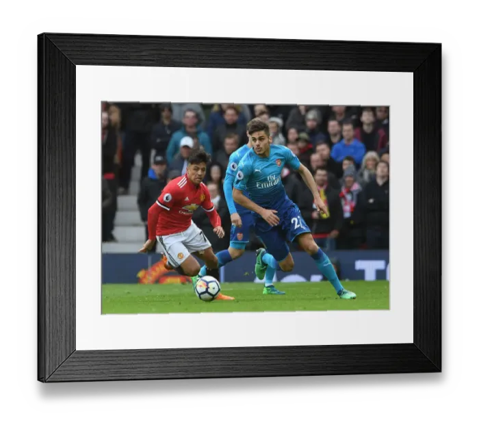 Framed Print : Mavropanos vs Sanchez: Intense Battle at Old Trafford - Manchester United vs Arsenal, Premier League 2017-18 Framed Print : Mavropanos vs Sanchez: Intense Battle at Old Trafford - Manchester United vs Arsenal, Premier League 2017-18