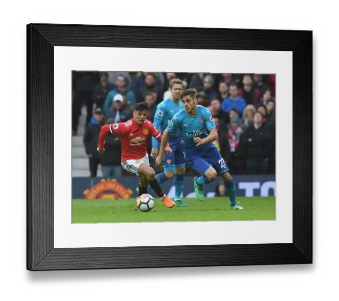 Framed Print : Mavropanos vs Sanchez: A Premier League Battle at Old Trafford Framed Print : Mavropanos vs Sanchez: A Premier League Battle at Old Trafford