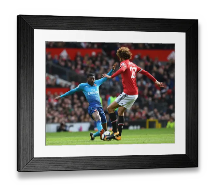 Framed Print : Clash at Old Trafford: Ainsley Maitland-Niles vs Marouane Fellaini - Premier League Showdown Framed Print : Clash at Old Trafford: Ainsley Maitland-Niles vs Marouane Fellaini - Premier League Showdown