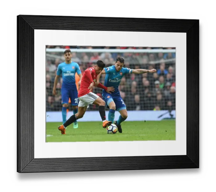 Framed Print : Xhaka vs. Sanchez: Clash of the Former Gunners in Manchester United vs. Arsenal Premier League Clash Framed Print : Xhaka vs. Sanchez: Clash of the Former Gunners in Manchester United vs. Arsenal Premier League Clash