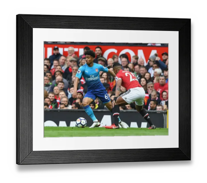 Framed Print : Reiss Nelson vs. Antonio Valencia: A Premier League Showdown at Old Trafford