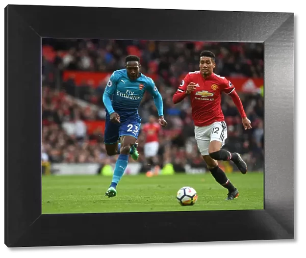 Welbeck vs Smalling: A Premier League Battle - Arsenal's Danny Welbeck Clashes with Manchester United's Chris Smalling
