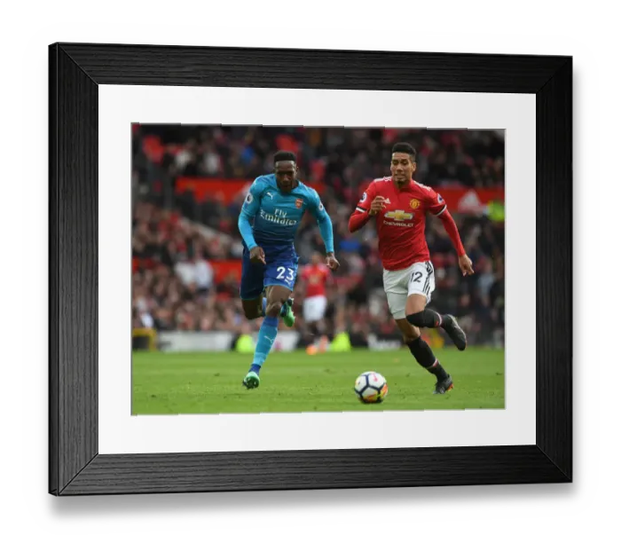 Framed Print : Welbeck vs Smalling: A Premier League Battle - Arsenal's Danny Welbeck Clashes with Manchester United's Chris Smalling Framed Print : Welbeck vs Smalling: A Premier League Battle - Arsenal's Danny Welbeck Clashes with Manchester United's Chris Smalling