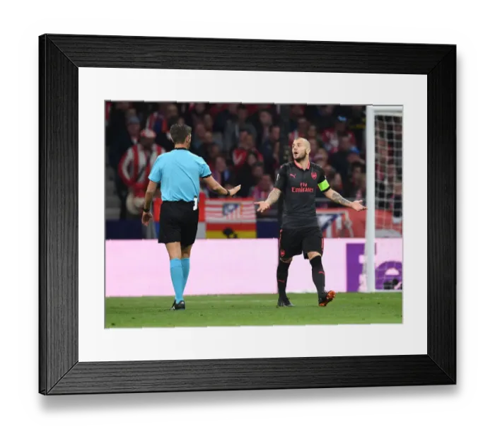 Framed Print : Jack Wilshere Protests to Referee Rocchi in Intense Atletico Madrid vs. Arsenal UEFA Europa League Clash Framed Print : Jack Wilshere Protests to Referee Rocchi in Intense Atletico Madrid vs. Arsenal UEFA Europa League Clash