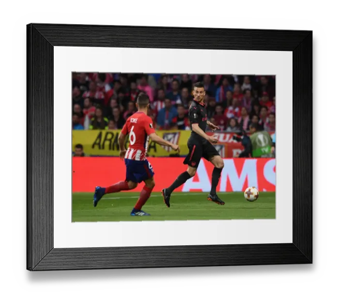 Framed Print : Laurent Koscielny in Action: Arsenal vs Atletico Madrid, UEFA Europa League Semi-Final Framed Print : Laurent Koscielny in Action: Arsenal vs Atletico Madrid, UEFA Europa League Semi-Final