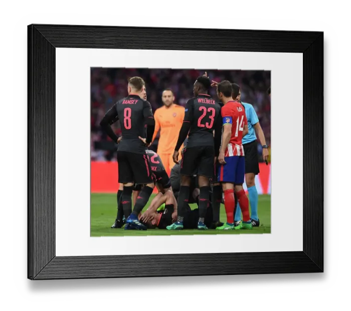Framed Print : Arsenal's Laurent Koscielny Injured in UEFA Europa League Semi-Final Clash Against Atletico Madrid
