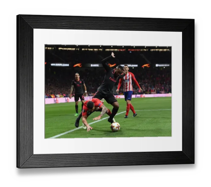 Framed Print : Clash in Madrid: Lacazette vs. Vitolo in the Europa League Semi-Final Showdown