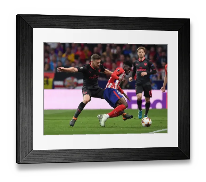 Framed Print : Mustafi vs. Partey: Intense Clash in Arsenal's Europa League Semi-Final Battle against Atletico Madrid