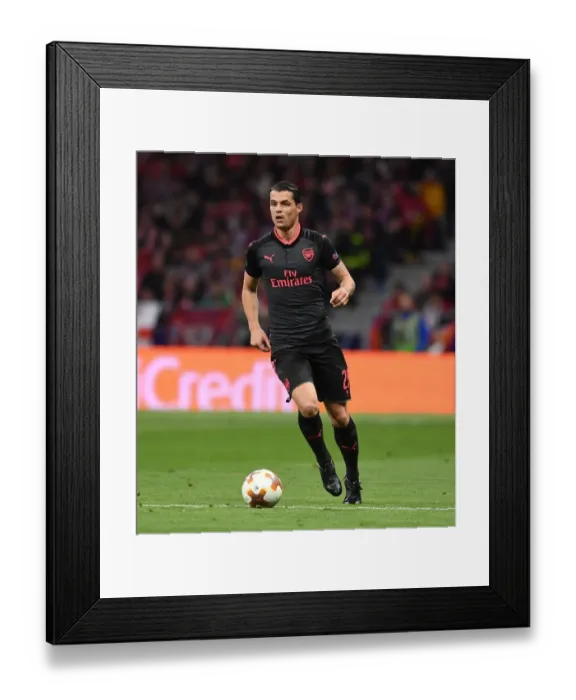 Framed Print : Granit Xhaka: Arsenal's Midfield Maestro in Europa League Battle against Atletico Madrid
