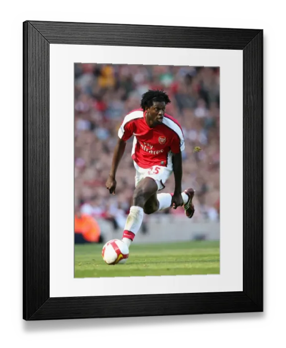 Framed Print : Arsenal's Premier League Triumph: Adebayor's Double Over Manchester City (2009) Framed Print : Arsenal's Premier League Triumph: Adebayor's Double Over Manchester City (2009)