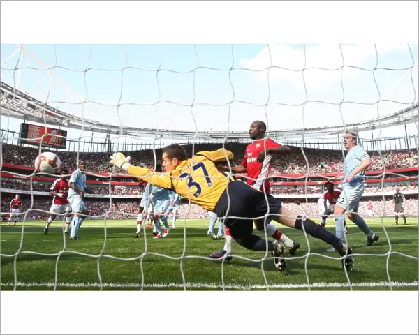 Emmanuel Adebayor heads past Shay Given to score the 1st Arsenal goal