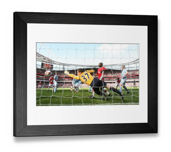 Framed Print : Emmanuel Adebayor heads past Shay Given to score the 1st Arsenal goal Framed Print : Emmanuel Adebayor heads past Shay Given to score the 1st Arsenal goal