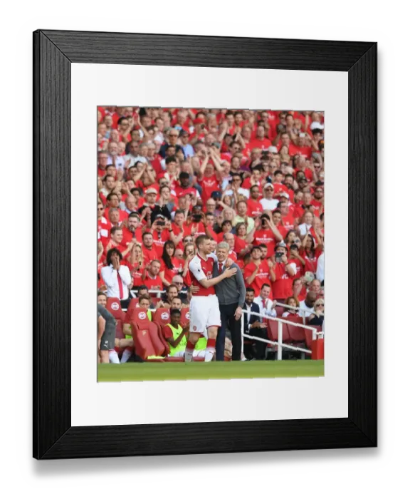 Framed Print : Mertesacker Embraces Wenger: A Heartfelt Moment between Player and Manager (Arsenal v Burnley, 2018)