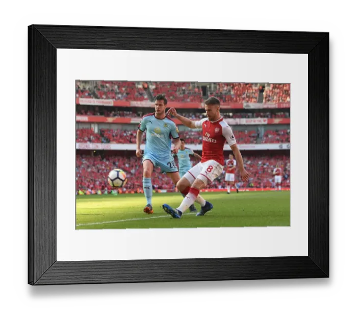 Framed Print : Intense Face-Off: Ramsey vs. Long - Arsenal's Premier League Battle