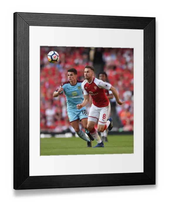 Framed Print : Arsenal's Aaron Ramsey Clashes with Burnley's Ashley Westwood in Premier League Showdown Framed Print : Arsenal's Aaron Ramsey Clashes with Burnley's Ashley Westwood in Premier League Showdown