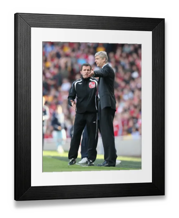 Framed Print : Arsenal manager Arsene Wenger talks with the 4th Official
